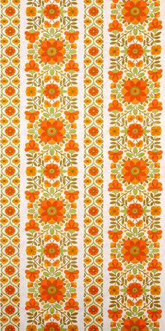 an orange and green flower pattern on white fabric with stripes in the background photo - free stock photo