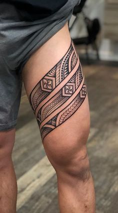 a man with a tattoo on his leg