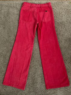 "Vintage Women's 70's Red, Low Rise, Bell Bottom, Jeans by Cheap Jeans (S) 1378 These Ladies jeans come in red colored denim and are low waisted, with two front pockets with two back pockets with a bell bottom leg shape. The denim is soft like a pant and does not stretch. Cotton/Polyester Blend *These pants are slightly too small for the mannequin and the zipper works properly. *If shipped within the US, this will go Priority Mail for a quick delivery! Size: (S) Modern Day 2 Waist: 28\" Hips: 32 Red Wide Leg Cotton Jeans, Red High Rise Jeans With Pockets, High Waist Red Flare Jeans, Red Full Length Cotton Jeans, Red Mid-rise Flare Jeans In Denim, Retro Red Wide Leg Jeans, Red Cotton Jeans With Pockets, Casual Red High Rise Flare Jeans, Retro Mid-rise Cotton Flare Jeans