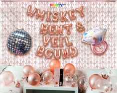 a party scene with balloons and streamers on the wall that says, whiskey bent veil round