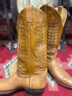 "Vintage Tony Lama western stitching cowboy boots size 9EE, style #6530, two tone brown color, stitch pattern resembling the wings of the phoenix. Good used condition, some wear, minor scuffing on the pointed toes, made in Usa. Please, check carefully the measurements, photos and description of the article before buying it, we do not accept changes or returns. Outsole Approximate Dimensions: 11 1/2\" long heel to toe. 10 3/4\" Inside from the heel to the toe. 4\" Widest wide in front of footwear Western Brown Boots For Ranch, Brown Western Boots For Ranch, Western Style Brown Boots For Ranch, Brown Concho Boots For Rodeo, Hand-tooled Brown Country Boots, Fitted Vintage Brown Western Boots, Brown Hand Tooled Boots For Western-themed Events, Hand Tooled Brown Boots For Western-themed Events, Southwestern Brown Snip Toe Boots