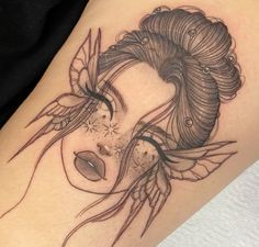 a woman's face with feathers and stars on her head is shown in this tattoo design