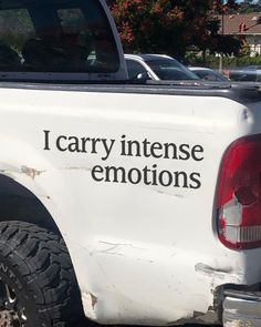 a white truck that has the words i carry intense emotions on it