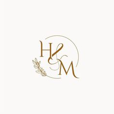 the letter h and m with an olive branch on it is shown in gold foil