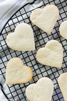 heart shaped cookies on a cooling rack ready to be cut into hearts for valentine's day