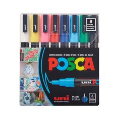 assorted markers and pens in display box for sale on a white background with the words posca below it