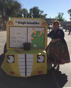 a woman sitting on the back of a yellow bus