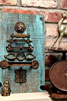 an old door with some knobs on it and a horse figurine next to it