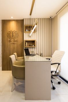 an office with a desk and chairs in it