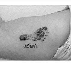 a black and white photo of a person's foot with the word mosela on it