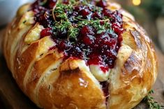 a cranberry bread is sitting on a cutting board