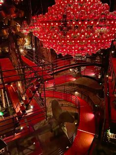 a large red chandelier hanging from the ceiling