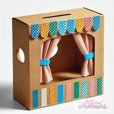 an open cardboard box with polka dot curtains