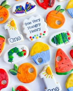 the very many decorated cookies have different designs on them, including one that says one very hungry henry