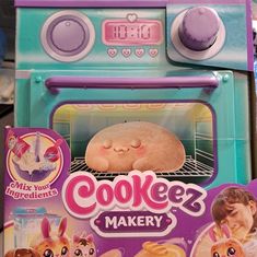 a toy oven with a cake in it's front and instructions on how to cook