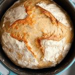 a loaf of bread sitting in a pan on top of a table