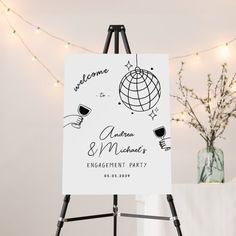 an easel with a sign that says welcome and michael's engagement party