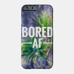 a phone case with the words bored af in white letters and green plants on it