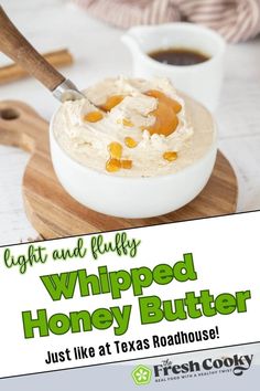 a bowl of whipped honey butter on a cutting board