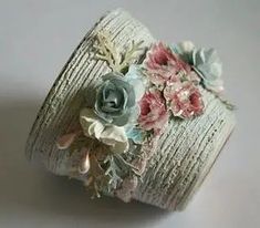 a roll of fabric with flowers and leaves on it