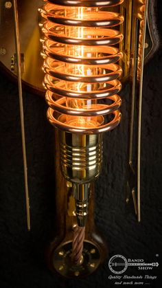 a close up of an old fashioned light fixture with wires attached to the back of it