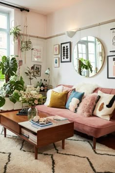 a living room filled with lots of furniture and decor