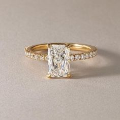 an engagement ring with a princess cut diamond