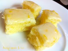 three pieces of lemon brownies on a plate with the words lemony lemon brownies