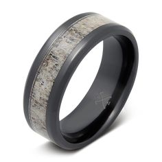 a black ceramic ring with antelope inlay