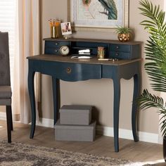 a blue desk with drawers and a clock on it in front of a window next to a chair