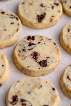 chocolate chip cookies sitting on top of a baking sheet