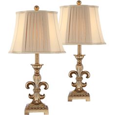 a pair of lamps that are next to each other on a white background with one lamp turned off and the other turned off