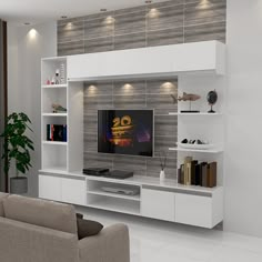 a living room with white furniture and a flat screen tv mounted to the side of a wall