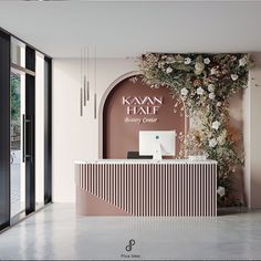 the front desk is decorated with flowers and greenery