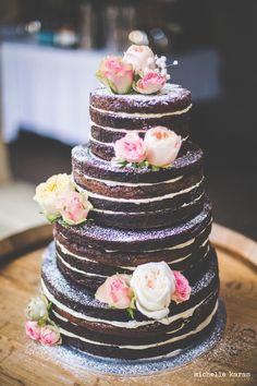 a wedding cake is decorated with flowers and frosting