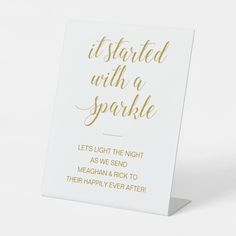 a white and gold foiled card with the words, it started with a sparkle