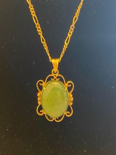 Absolutely gorgeous natural jade pendant Victorian necklace in gold tone chain. The gemstone is an oval cabochon. It is 1.5" long x .9" wide. The chain is 18 inches long. In excellent vintage condition. - Please note, most of my store's items are vintage or pre-owned. Most items are in very good/good vintage pre-owned condition. - Thank you so much for shopping with me and please check out my other jewelry listings, I post new items daily! Oval Jade Gold Necklace, Jade Cabochon Oval Pendant Necklace, Oval Jade Cabochon Necklaces, Oval Jade Cabochon Necklace, Vintage Oval Jade Necklace, Antique Green Oval Pendant Necklace, Vintage Green Oval Necklace, Jade Pendant Necklace, Grants Pass