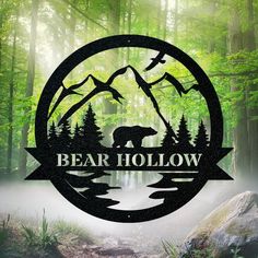 the bear hollow logo is surrounded by trees