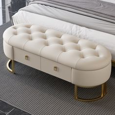 a white bench sitting next to a bed on top of a carpeted bedroom floor