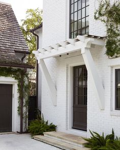 the instagram page on instagram shows an image of a white house with black doors and windows