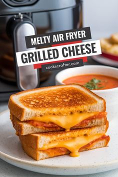 a grilled cheese sandwich on a plate with the words melty air fryer grilled cheese