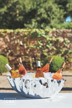 six bottles of wine in an ice bucket