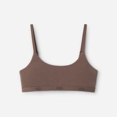 Comfort you can live in. The Estella Bralette is a buttery soft scoop neck bralette with adjustable straps and a lightly supportive, double-layered fabrication. | Pullover scoop neck bralette. 90% LENZING ECOVERO Viscose/10% Elastane. Adjustable shoulder straps. Double layered construction. The UGG® Logo repeated on satin elastic waistband. Chest Size 34-35 inch [Size S]. Chest Size 48-50 inch [Size 2X]. Imported. | UGG® Women's Estella Bralette LENZING\u2122 ECOVERO\u2122 Viscose Blend Bralettes|Intimates in Allspice, Size S Womens Uggs, Bralette, Adjustable Straps, Top Outfits, Clothes For Women, Fabric, How To Wear