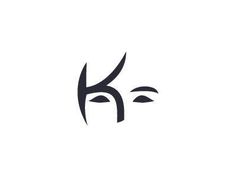 the letter k is made up of two faces and has black lines on it, which are