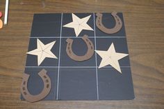 some cut out stars and horseshoes on a table