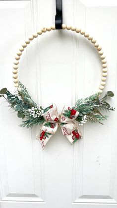 a christmas wreath hanging on the front door