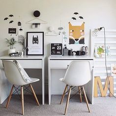 two white desks sitting next to each other