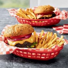 two baskets filled with cheeseburger and fries