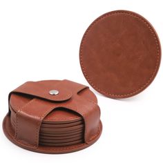 a brown leather case with a round hole in the middle and four smaller pieces on each side