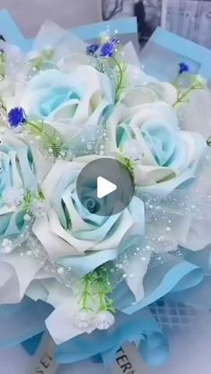 a blue and white bouquet is shown in this still - life video screen graber